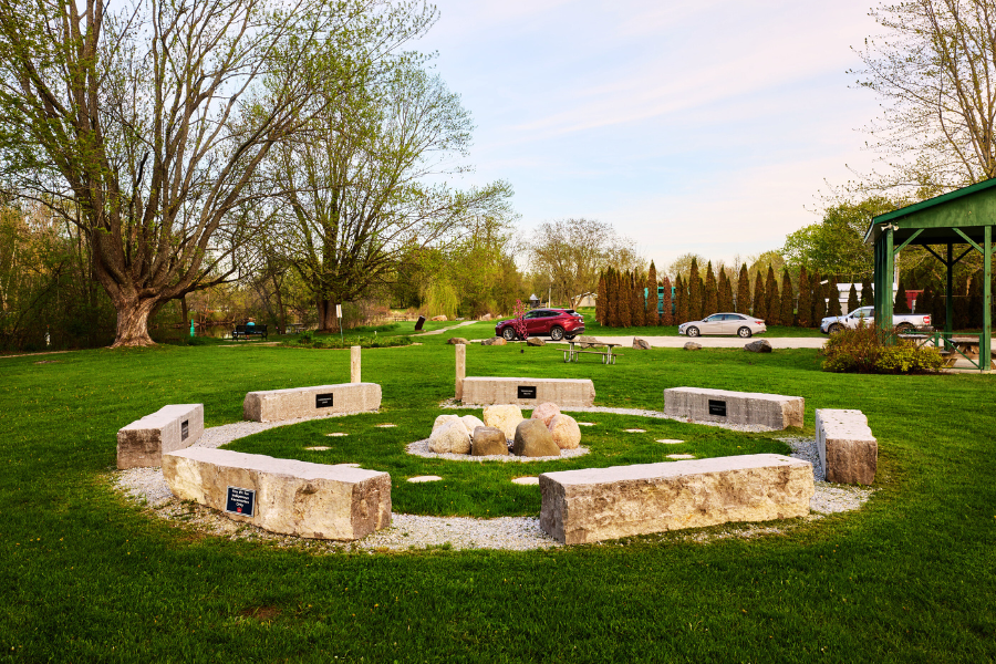 Stone benches formed in a circle around a ceremonial stone firepit