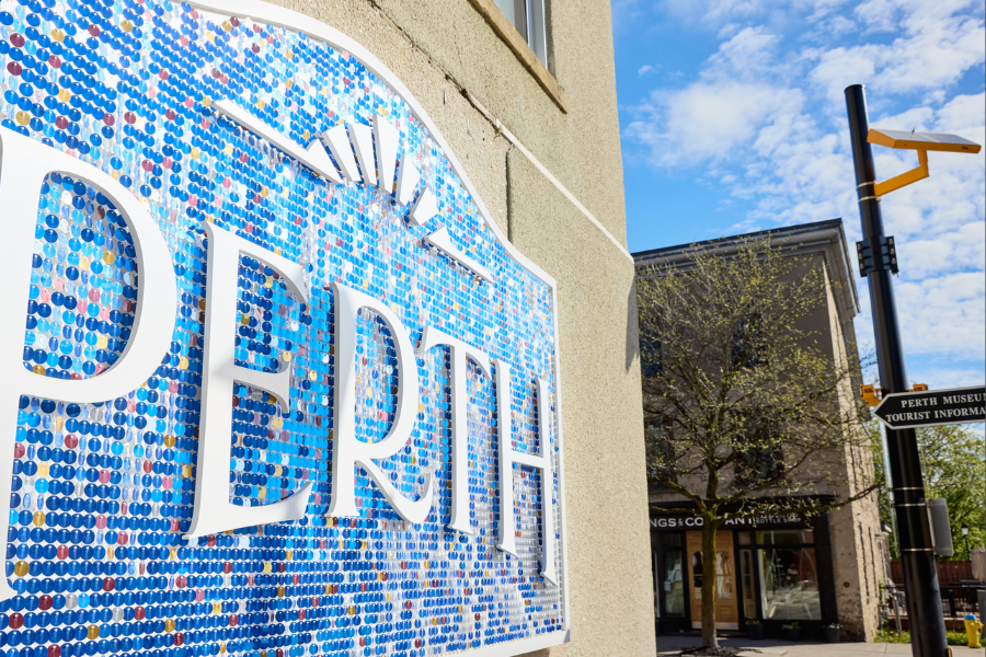 White Perth sign with blue sequin background
