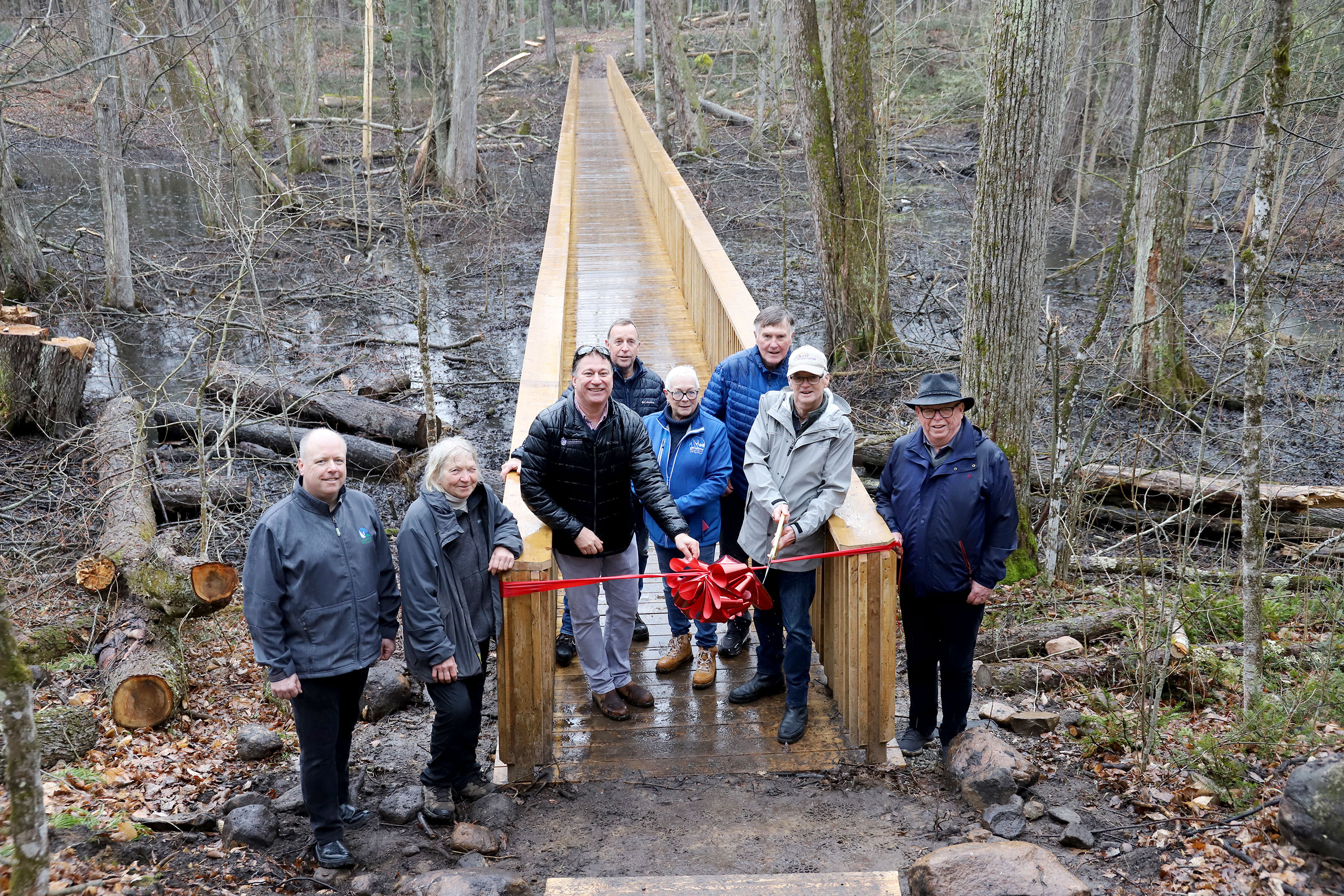 Gathering at one end of the new Hi-Lo Boardwalk at the H.R. Frink Conservation Area are, from left to right, Paul Carr, Belleville councillor; Bea Heissler, retired H.R. Frink educator; Brad McNevin, Quinte Conservation CAO; Peter Rhebergen, Ducon; Kathryn Brown, Belleville councillor; Douglas Moses, John M. and Bernice Parrott Foundation; Lyle Vanclief, John M. and Bernice Parrott Foundation; Terry Murphy, retired Quinte Conservation general manager. 