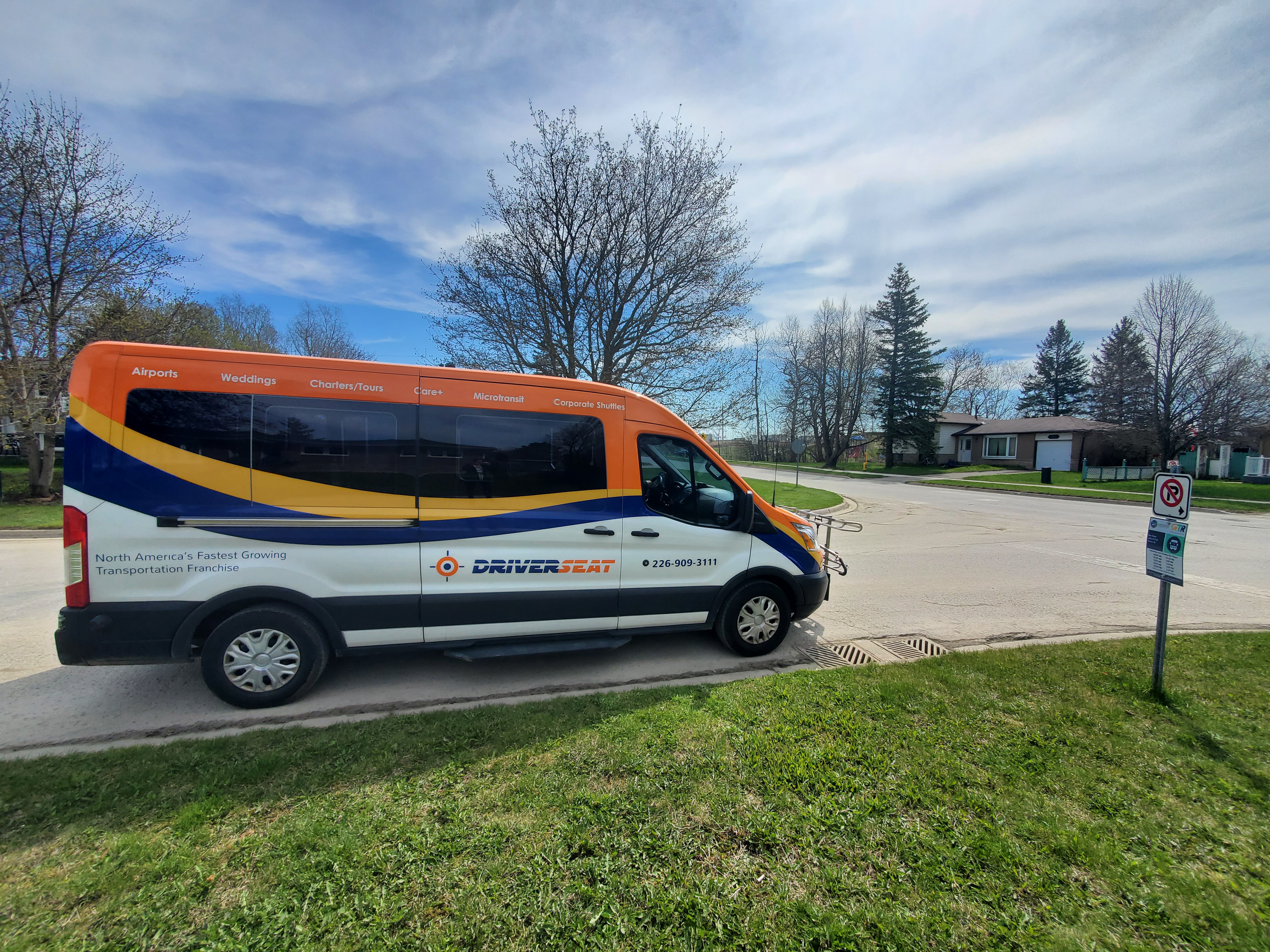 photo: orange bus with 2 people Grey County announces the official start date of the Grey Transportation Route on Tues., Aug. 25, 2020