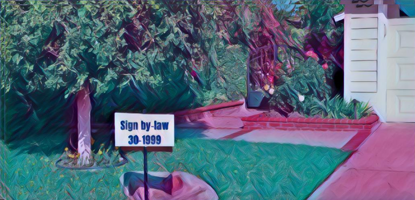 Picture of a lawn with a sign on it