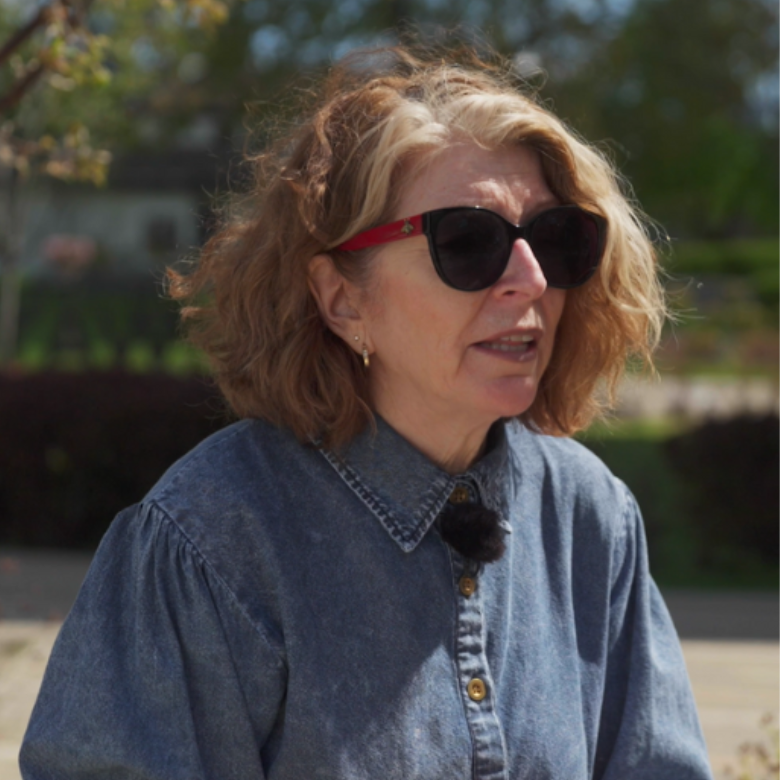 A woman wearing sunglasses outdoors