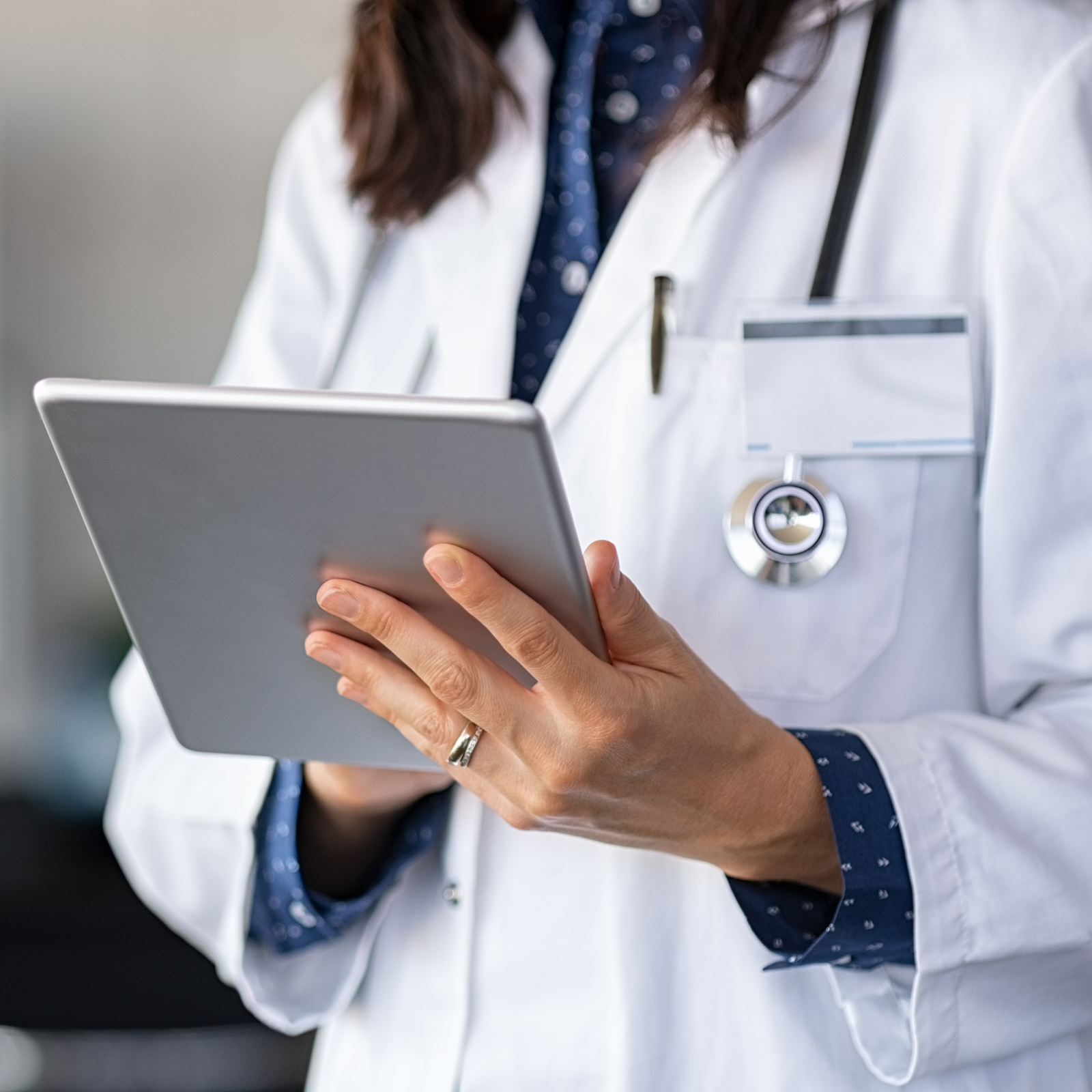 Close up of a health care provider holding a clip board