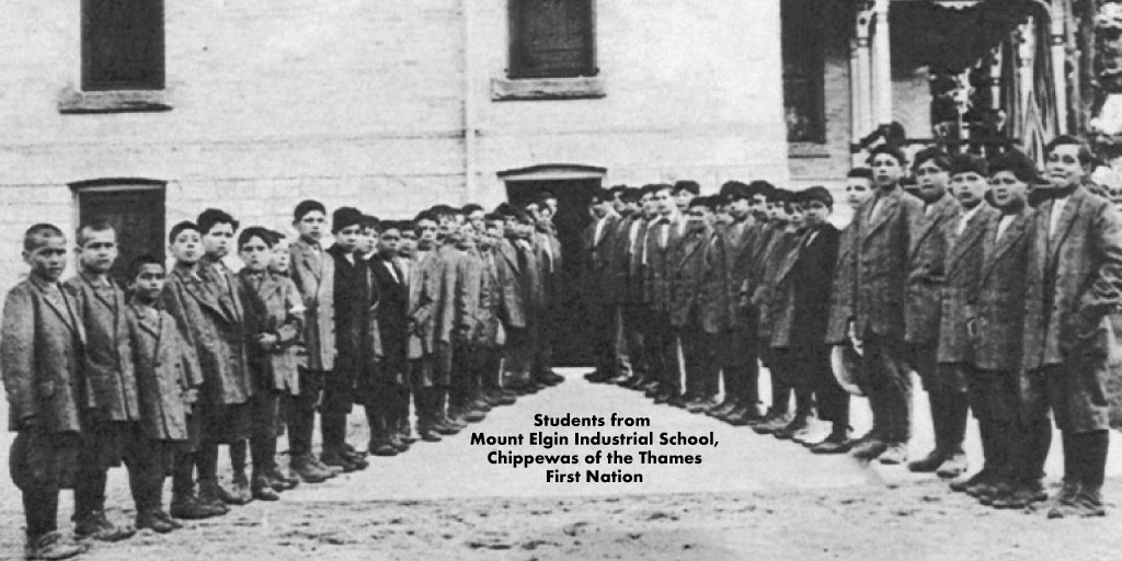 Residential School students stand outside the former Mount Elgin Industrial School in Chippewas of the Thames First Nation